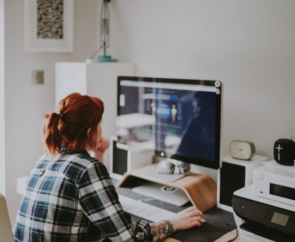 woman staring a blurry screen