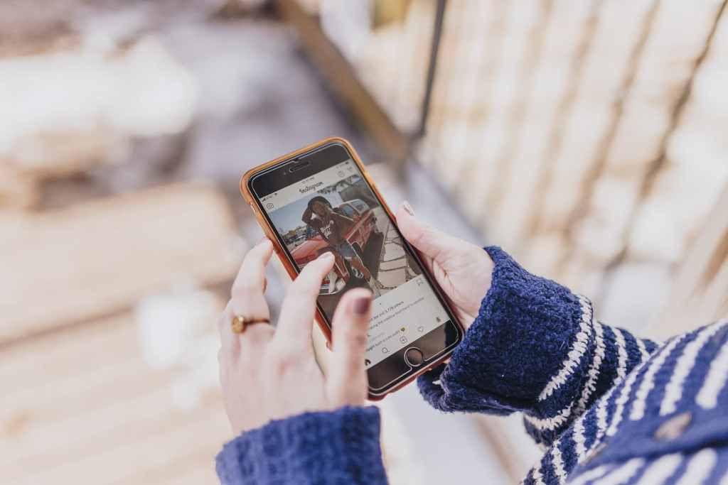 Woman scrolling through instagram